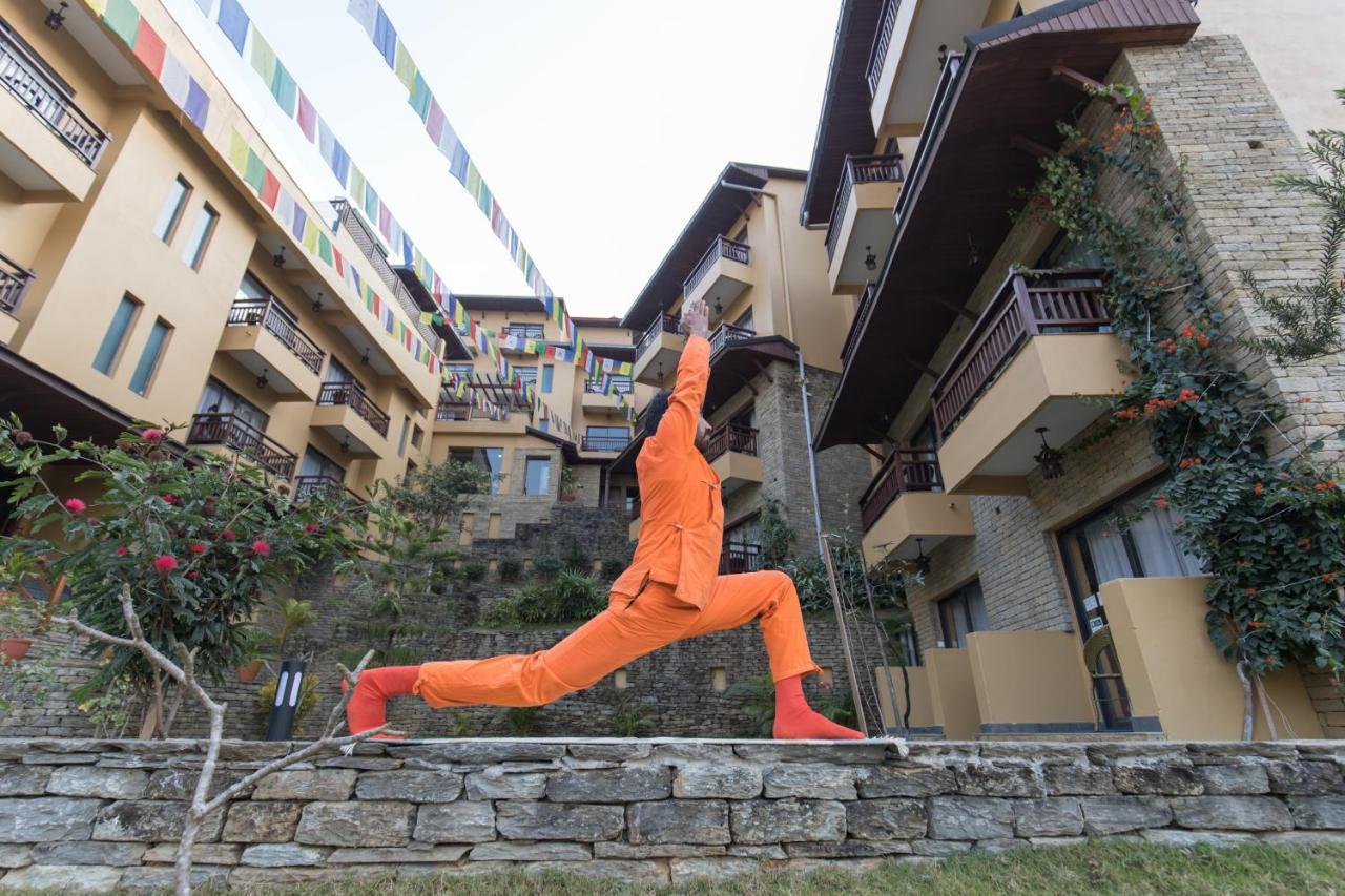 Bar Peepal Resort Pokhara Exteriör bild A student of the Drepung Loseling Nunnery, practicing yoga.